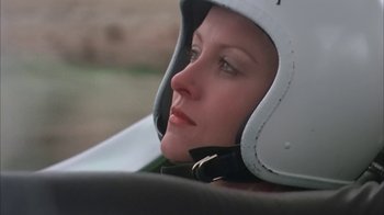 Movie still from “Death Race 2000” (1975), directed by Paul Bartel – A person wearing a motorcycle helmet; Close Up shot, Low angle