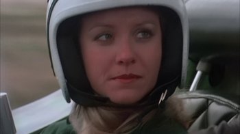 Movie still from “Death Race 2000” (1975), directed by Paul Bartel – A person wearing a motorcycle helmet; Close Up shot, Low angle