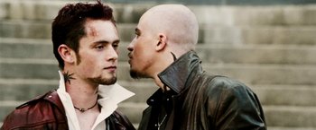 Movie still from “Death Sentence” (2007), directed by James Wan – Two men standing next to each other on some steps; Close Up shot, Over the shoulder angle