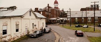 Movie still from “Death Sentence” (2007), directed by James Wan – A couple of cars parked on the side of the street; Extreme Wide shot, High angle