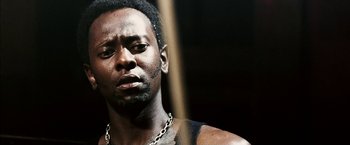 Movie still from “Death Sentence” (2007), directed by James Wan – A person with a chain around his neck; Close Up shot, Low angle