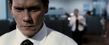 Movie still from “Death Sentence” (2007), directed by James Wan – A person wearing a white shirt and tie; Close Up shot, Low angle