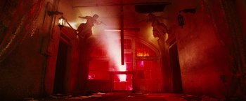 Movie still from “Death Sentence” (2007), directed by James Wan – A room that has a statue on the wall and a window; Wide shot, Low angle