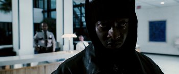 Movie still from “Death Sentence” (2007), directed by James Wan – A man in a black jacket and a black hat; Close Up shot, Low angle