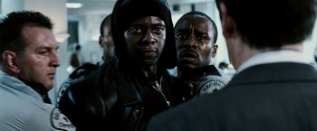 Movie still from “Death Sentence” (2007), directed by James Wan – Two black men standing next to each other in a crowd; Close Up shot, Over the shoulder angle