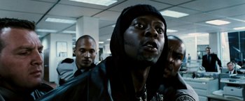 Movie still from “Death Sentence” (2007), directed by James Wan – A group of men standing next to each other in a room; Close Up shot, Low angle