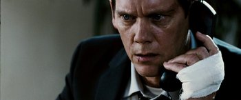 Movie still from “Death Sentence” (2007), directed by James Wan – A person talking on a phone; Close Up shot, Low angle