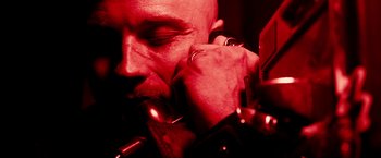 Movie still from “Death Sentence” (2007), directed by James Wan – A person holding a microphone; Extreme Close Up shot, Overhead angle