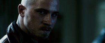 Movie still from “Death Sentence” (2007), directed by James Wan – A man's face in a darkened room; Close Up shot, Over the shoulder angle