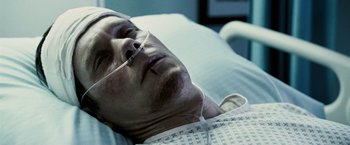 Movie still from “Death Sentence” (2007), directed by James Wan – An older man laying in a hospital bed with his eyes closed; Close Up shot, High angle