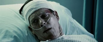 Movie still from “Death Sentence” (2007), directed by James Wan – A person with a bandage on his head; Close Up shot, Overhead angle