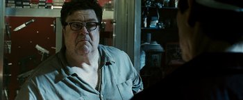 Movie still from “Death Sentence” (2007), directed by James Wan – An older man wearing glasses sitting in front of a window; Close Up shot, Low angle