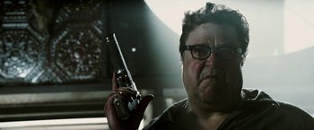 Movie still from “Death Sentence” (2007), directed by James Wan – A man holding a cell phone in his hand; Close Up shot, Low angle