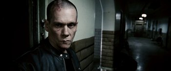 Movie still from “Death Sentence” (2007), directed by James Wan – A person wearing a leather jacket; Close Up shot, Low angle
