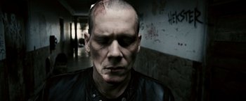 Movie still from “Death Sentence” (2007), directed by James Wan – A person wearing a leather jacket; Close Up shot, Low angle