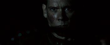 Movie still from “Death Sentence” (2007), directed by James Wan – A person's face in the dark; Close Up shot, Over the shoulder angle