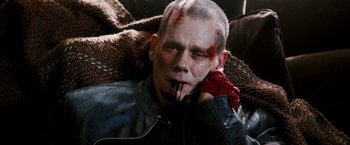 Movie still from “Death Sentence” (2007), directed by James Wan – A man with blood all over his face and head; Close Up shot, High angle