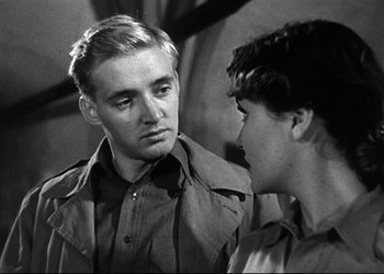 Movie still from “Decision Before Dawn” (1951), directed by Anatole Litvak – A man and a woman talking to each other; Close Up shot, Over the shoulder angle