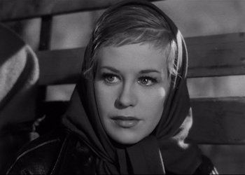 Movie still from “Decision Before Dawn” (1951), directed by Anatole Litvak – Black and white photograph of a woman wearing a head scarf; Close Up shot, Low angle