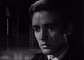 Movie still from “Decision Before Dawn” (1951), directed by Anatole Litvak – A black - and - white photo of a man in a suit; Close Up shot, Low angle