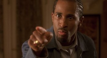 Movie still from “Deliver Us from Eva” (2003), directed by Gary Hardwick – A person holding a ring; Close Up shot, Low angle