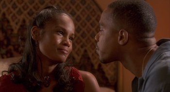 Movie still from “Deliver Us from Eva” (2003), directed by Gary Hardwick – A man and a woman looking at one another; Close Up shot, Over the shoulder angle