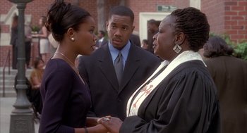 Movie still from “Deliver Us from Eva” (2003), directed by Gary Hardwick – A couple of people that are talking to each other; Medium shot, Over the shoulder angle