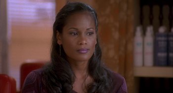 Movie still from “Deliver Us from Eva” (2003), directed by Gary Hardwick – A person with long black hair; Close Up shot, High angle