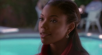 Movie still from “Deliver Us from Eva” (2003), directed by Gary Hardwick – A person wearing a red jacket; Close Up shot, High angle