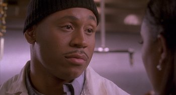 Movie still from “Deliver Us from Eva” (2003), directed by Gary Hardwick – A person wearing a hat; Close Up shot, Low angle