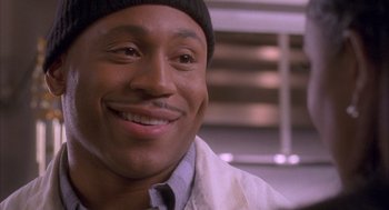 Movie still from “Deliver Us from Eva” (2003), directed by Gary Hardwick – A person wearing a hat; Close Up shot, Over the shoulder angle