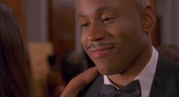 Movie still from “Deliver Us from Eva” (2003), directed by Gary Hardwick – A person wearing a bow tie; Close Up shot, Low angle