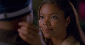 Movie still from “Deliver Us from Eva” (2003), directed by Gary Hardwick – A person with a cell phone; Close Up shot, Over the shoulder angle