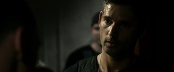Movie still from “Deliver Us from Evil” (2014), directed by Scott Derrickson – A person wearing a black shirt; Close Up shot, Over the shoulder angle