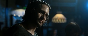 Movie still from “Deliver Us from Evil” (2014), directed by Scott Derrickson – A person wearing a black t - shirt; Close Up shot, Over the shoulder angle