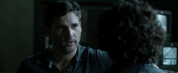 Movie still from “Deliver Us from Evil” (2014), directed by Scott Derrickson – A person wearing a black shirt; Close Up shot, Over the shoulder angle