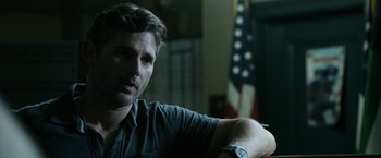 Movie still from “Deliver Us from Evil” (2014), directed by Scott Derrickson – A person sitting on a couch; Close Up shot, Over the shoulder angle