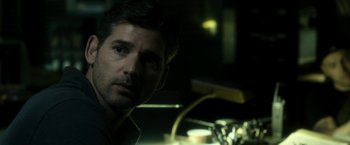 Movie still from “Deliver Us from Evil” (2014), directed by Scott Derrickson – A person in a dark room; Close Up shot, Over the shoulder angle