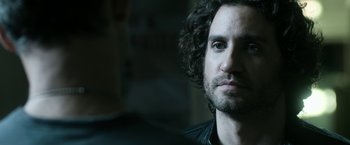 Movie still from “Deliver Us from Evil” (2014), directed by Scott Derrickson – A person with curly hair; Close Up shot, Over the shoulder angle