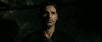 Movie still from “Deliver Us from Evil” (2014), directed by Scott Derrickson – A person wearing a black shirt; Close Up shot, Over the shoulder angle