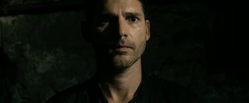 Movie still from “Deliver Us from Evil” (2014), directed by Scott Derrickson – A person wearing a black shirt; Close Up shot, Low angle