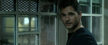 Movie still from “Deliver Us from Evil” (2014), directed by Scott Derrickson – A person wearing a black shirt; Close Up shot, Over the shoulder angle