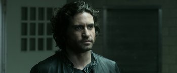 Movie still from “Deliver Us from Evil” (2014), directed by Scott Derrickson – A person wearing a leather jacket; Close Up shot, Over the shoulder angle