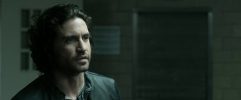 Movie still from “Deliver Us from Evil” (2014), directed by Scott Derrickson – A person wearing a leather jacket; Close Up shot, Over the shoulder angle