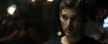 Movie still from “Deliver Us from Evil” (2014), directed by Scott Derrickson – A person wearing a black t - shirt; Close Up shot, Over the shoulder angle
