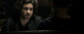 Movie still from “Deliver Us from Evil” (2014), directed by Scott Derrickson – A man looking at himself in the mirror; Close Up shot, Over the shoulder angle