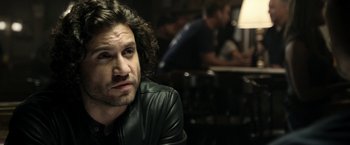 Movie still from “Deliver Us from Evil” (2014), directed by Scott Derrickson – A person wearing a leather jacket; Close Up shot, Over the shoulder angle