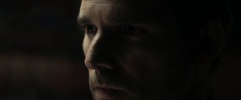 Movie still from “Deliver Us from Evil” (2014), directed by Scott Derrickson – A man's face in the dark; Extreme Close Up shot, Over the shoulder angle
