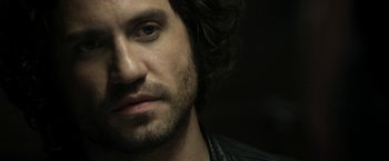 Movie still from “Deliver Us from Evil” (2014), directed by Scott Derrickson – A person wearing a leather jacket; Close Up shot, Over the shoulder angle
