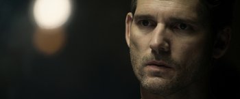 Movie still from “Deliver Us from Evil” (2014), directed by Scott Derrickson – A man's face in a dark room; Close Up shot, Over the shoulder angle